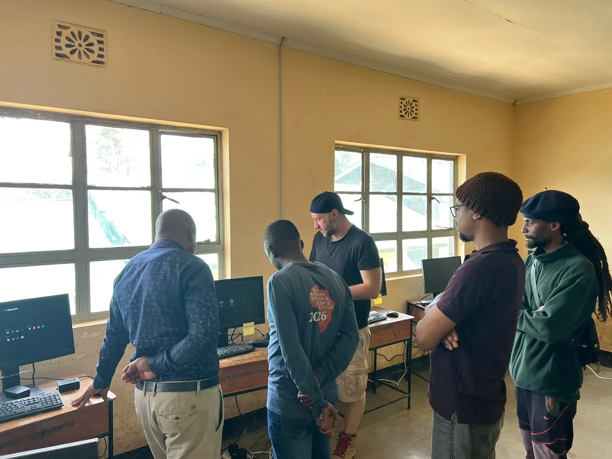 Team members showing UjimaOS to teachers in the Nkoarisambu computer lab.